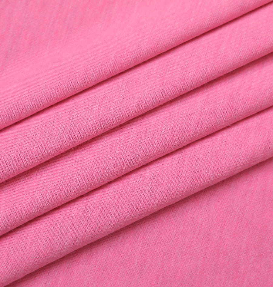 What are the key characteristics and versatile applications of Single Jersey Fabric, and how does the choice of fiber content impact the fabric's performance and properties in various end uses?